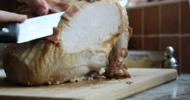 Carving a roast turkey on a wooden board
